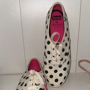 Keds Blue Logo on Textured Tan Background